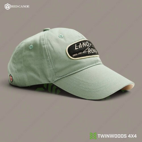 Land Rover Grasmere Green cap Red Canoe right